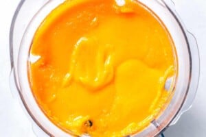 blending pumpkin puree in a blender.