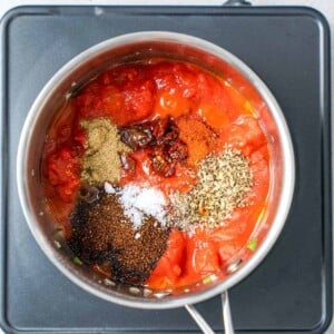 sauce ingredients added to a pan with the seasonings.
