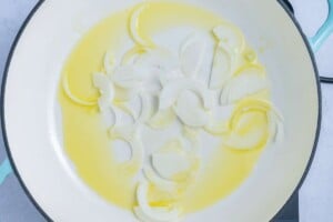 Sliced onion was added to a pan with oil.